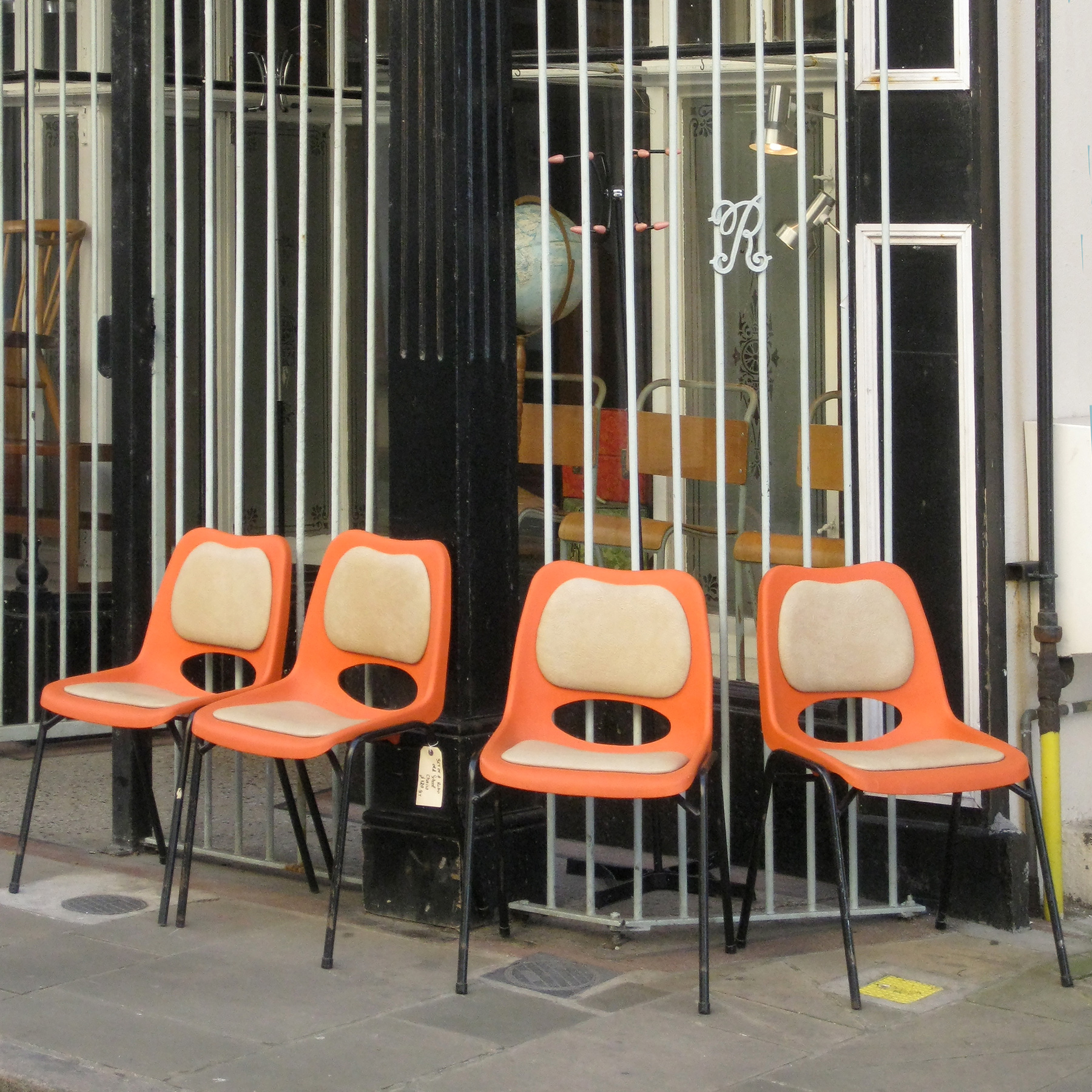 four orange chairs