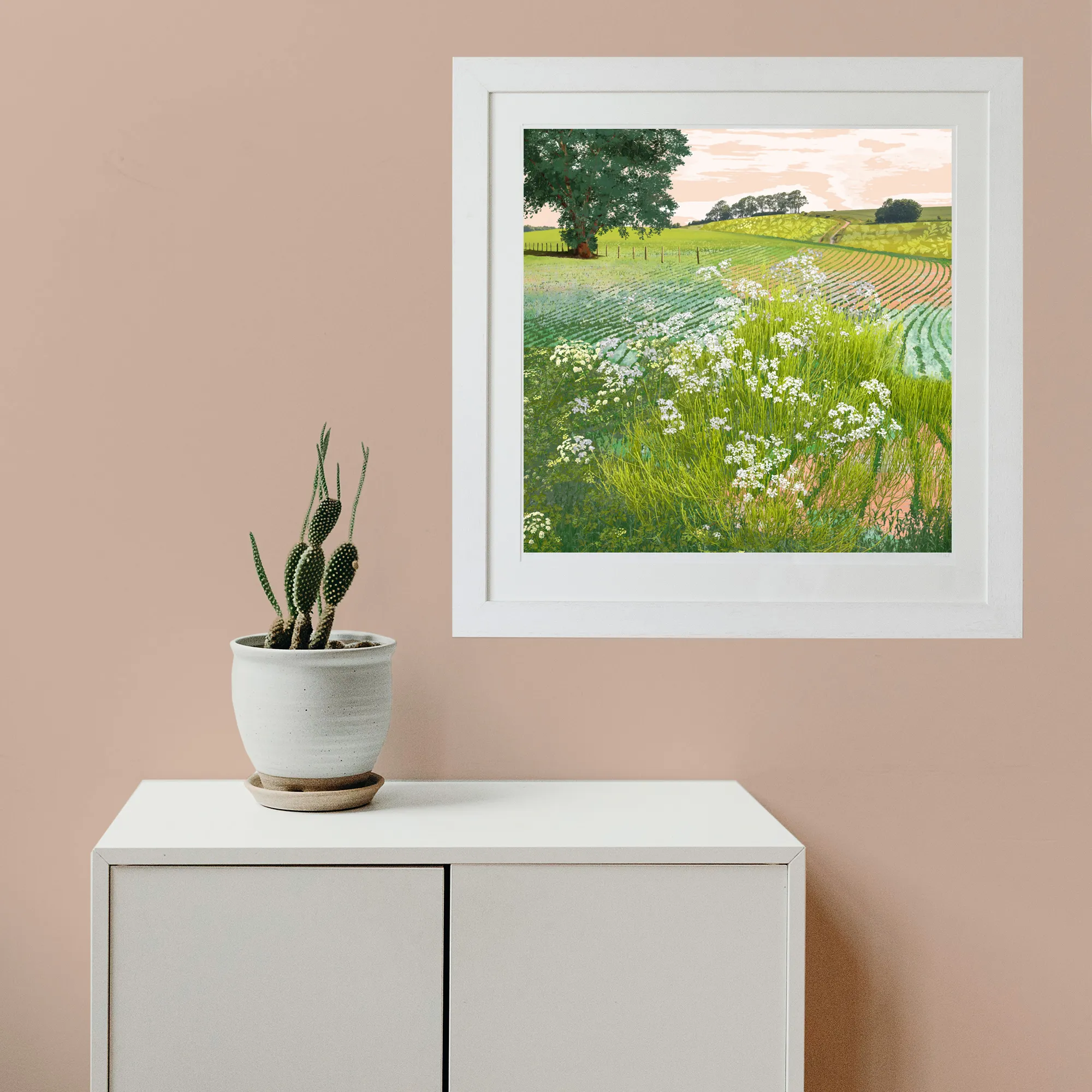Rolling hills fine art limited edition landscape print in a white frame pictures on a pink wall