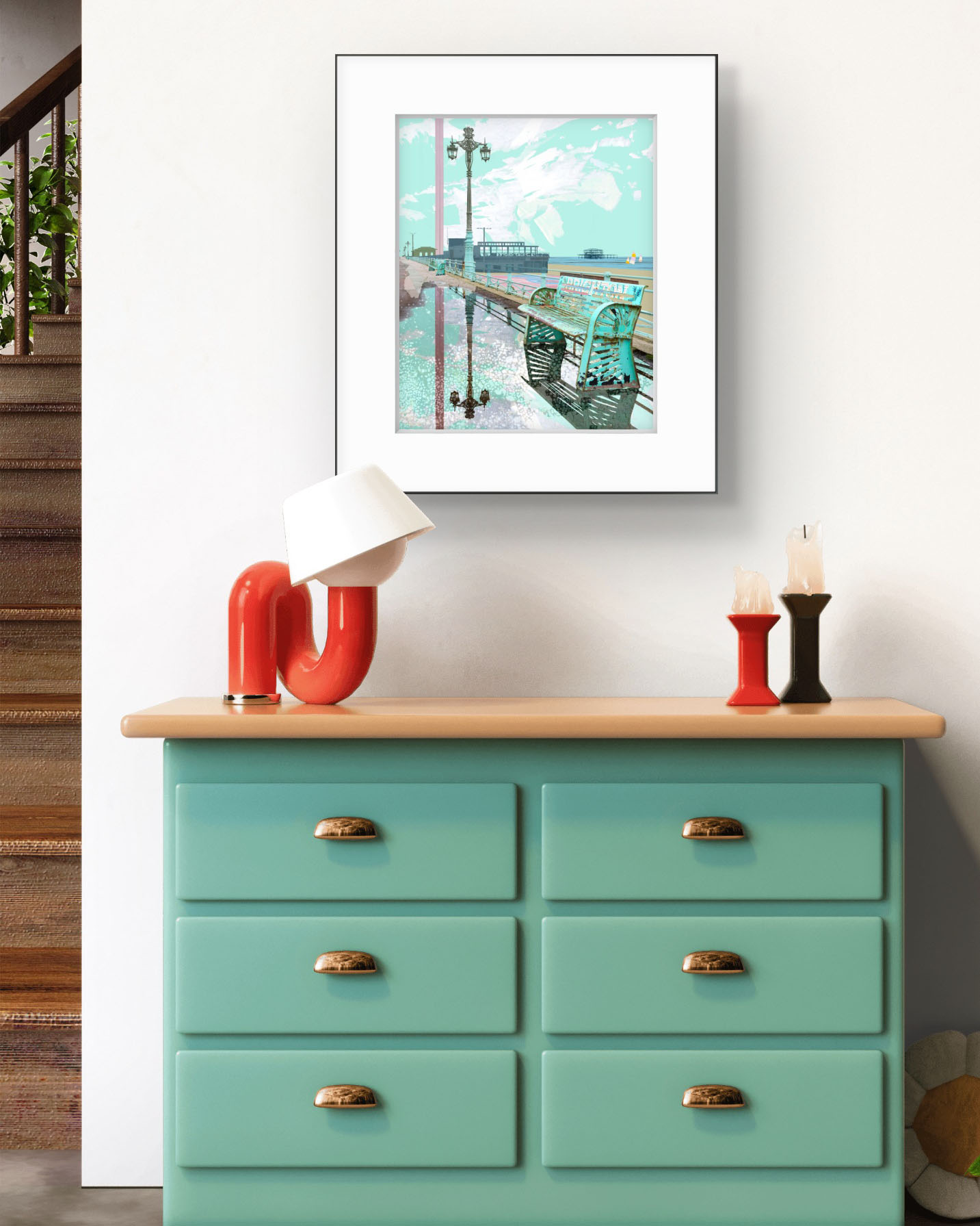 Framed Brighton Bench print by Claire Gill on interior wall above a turquoise chest of drawers