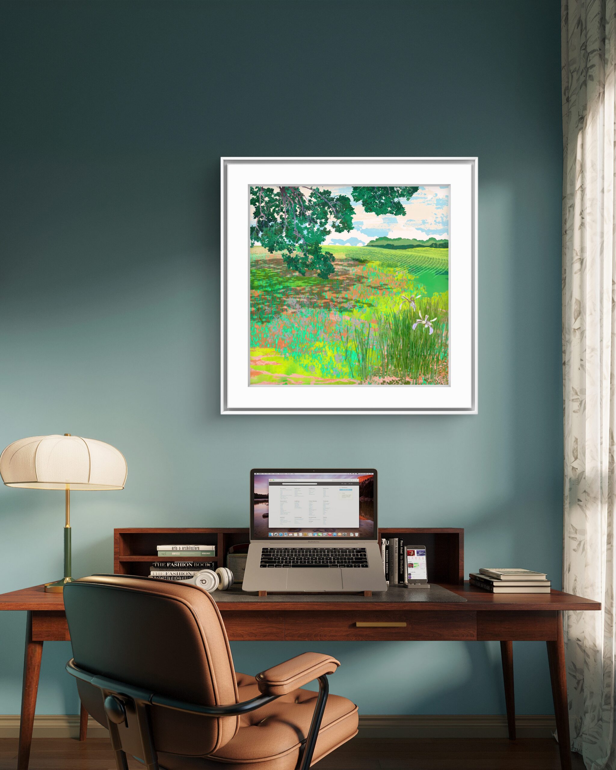 Momentary framed green landscape artwork displayed above a desk in a contemporary interior